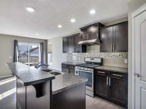 5325 15 Avenue, Edmonton, AB - Indoor Photo Showing Kitchen With Stainless Steel Kitchen With Double Sink With Upgraded Kitchen