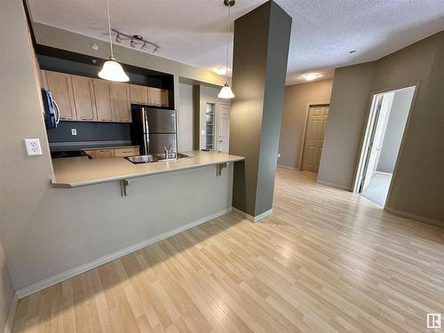 1-212 4245 139 Avenue, Edmonton, AB - Indoor Photo Showing Kitchen With Double Sink