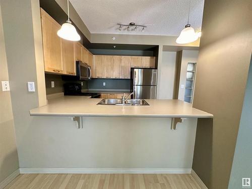 1-212 4245 139 Avenue, Edmonton, AB - Indoor Photo Showing Kitchen With Double Sink