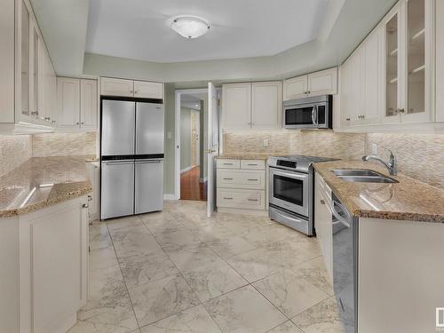 7C 10050 118 Street, Edmonton, AB - Indoor Photo Showing Kitchen With Stainless Steel Kitchen With Double Sink With Upgraded Kitchen