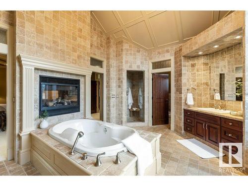 37 Riverridge Road, Rural Sturgeon County, AB - Indoor Photo Showing Bathroom With Fireplace