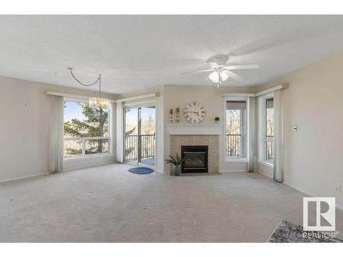 403 75 Gervais Road, St. Albert, AB - Indoor Photo Showing Living Room With Fireplace