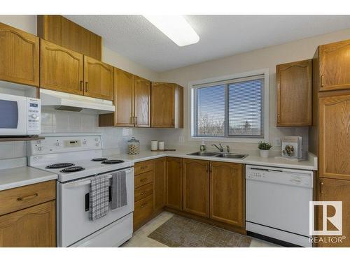 403 75 Gervais Road, St. Albert, AB - Indoor Photo Showing Kitchen With Double Sink