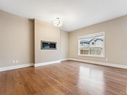 3915 Agar Court, Edmonton, AB - Indoor Photo Showing Living Room With Fireplace