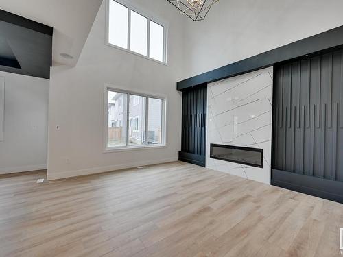 9 Elderberry Point(E), Fort Saskatchewan, AB - Indoor Photo Showing Other Room With Fireplace