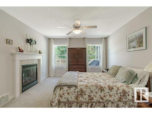 20578 92A Avenue, Edmonton, AB - Indoor Photo Showing Bedroom With Fireplace