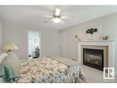 20578 92A Avenue, Edmonton, AB - Indoor Photo Showing Bedroom With Fireplace