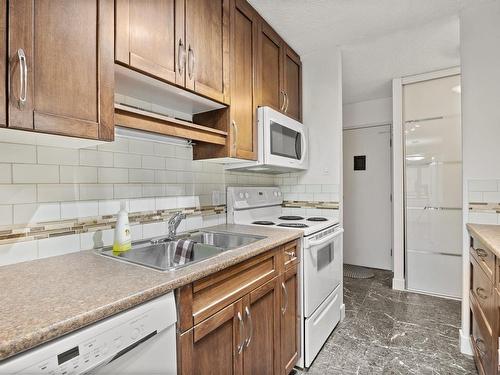 1001 9725 106 Street, Edmonton, AB - Indoor Photo Showing Kitchen With Double Sink