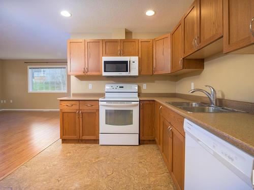 4910 58 Street, Athabasca Town, AB - Indoor Photo Showing Kitchen With Double Sink