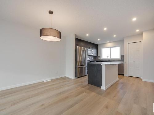 2462 Trumpeter Way, Edmonton, AB - Indoor Photo Showing Kitchen With Upgraded Kitchen