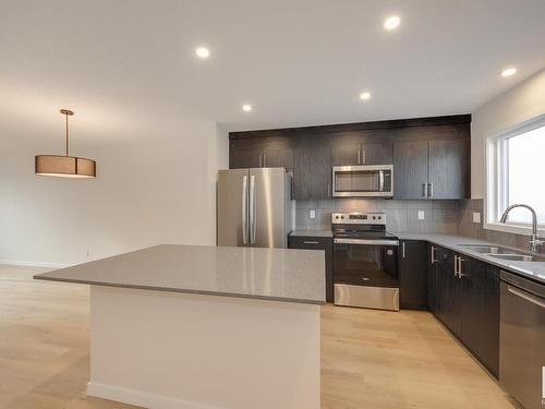 2462 Trumpeter Way, Edmonton, AB - Indoor Photo Showing Kitchen With Stainless Steel Kitchen With Double Sink With Upgraded Kitchen