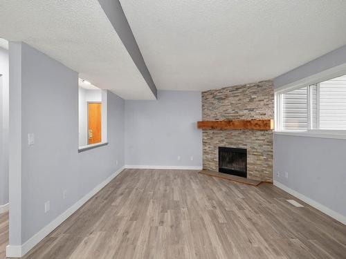 111 12416 161 Avenue, Edmonton, AB - Indoor Photo Showing Living Room With Fireplace