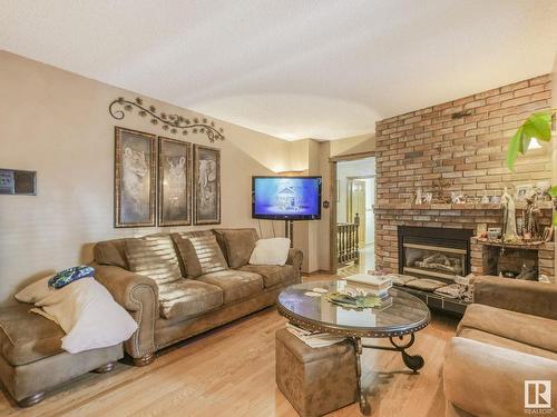 181 22555 Twp Road 530, Rural Strathcona County, AB - Indoor Photo Showing Living Room With Fireplace