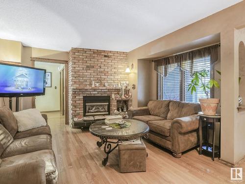 181 22555 Twp Road 530, Rural Strathcona County, AB - Indoor Photo Showing Living Room With Fireplace