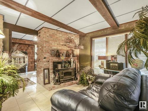 181 22555 Twp Road 530, Rural Strathcona County, AB - Indoor Photo Showing Living Room With Fireplace