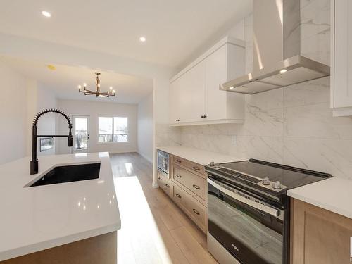 179 Stonehouse Way, Leduc, AB - Indoor Photo Showing Kitchen With Upgraded Kitchen