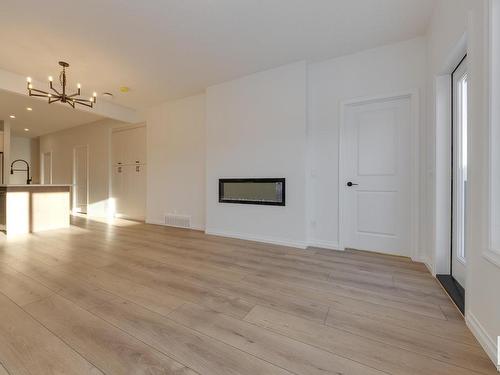 179 Stonehouse Way, Leduc, AB - Indoor Photo Showing Living Room With Fireplace