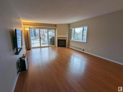 305 10130 114 Street, Edmonton, AB - Indoor Photo Showing Living Room With Fireplace