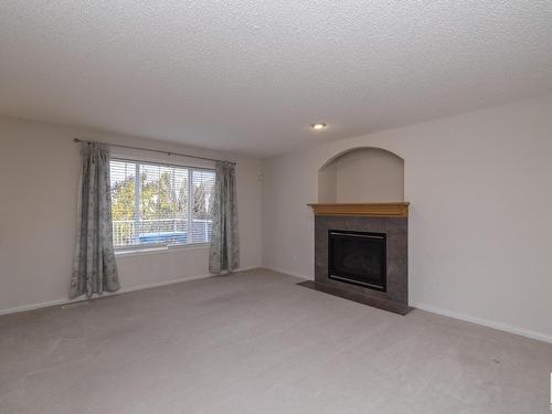 1026 Rutherford Place, Edmonton, AB - Indoor Photo Showing Living Room With Fireplace