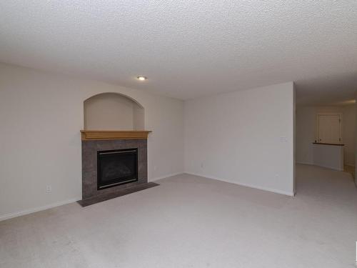 1026 Rutherford Place, Edmonton, AB - Indoor Photo Showing Living Room With Fireplace