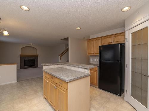 1026 Rutherford Place, Edmonton, AB - Indoor Photo Showing Kitchen With Fireplace