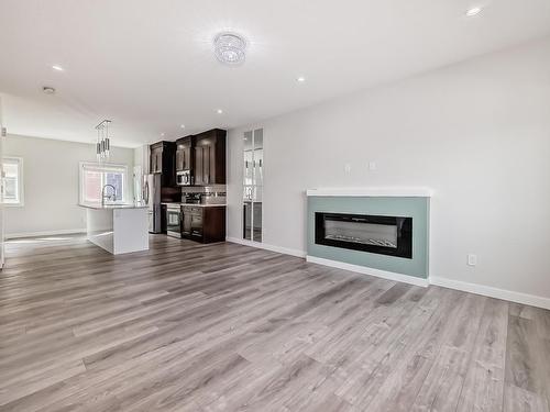 13 2803 14 Avenue, Edmonton, AB - Indoor Photo Showing Living Room With Fireplace