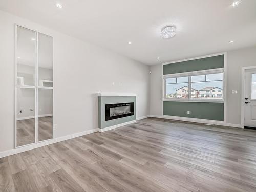 13 2803 14 Avenue, Edmonton, AB - Indoor Photo Showing Living Room With Fireplace