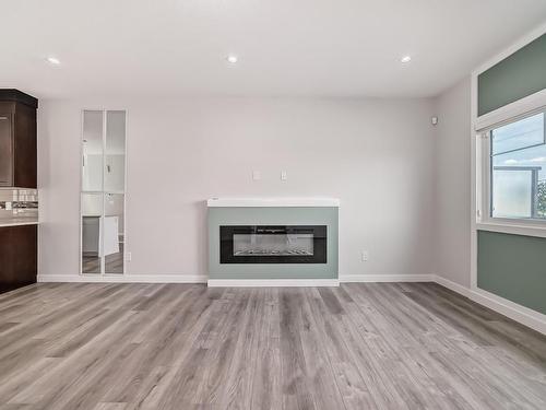 13 2803 14 Avenue, Edmonton, AB - Indoor Photo Showing Living Room With Fireplace