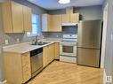 1004 610 King Street, Spruce Grove, AB  - Indoor Photo Showing Kitchen With Double Sink 