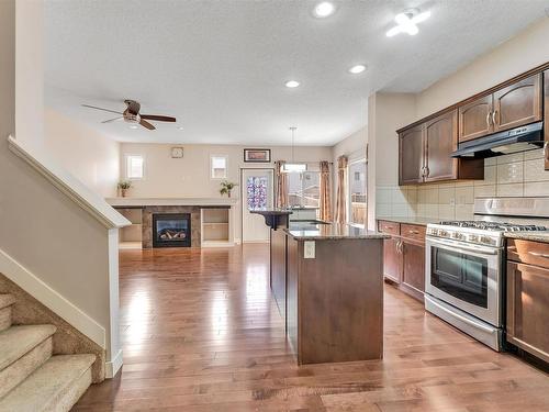 2815 17 Avenue Nw, Edmonton, AB - Indoor Photo Showing Kitchen With Fireplace