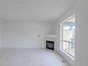 88 10909 106 Street, Edmonton, AB  - Indoor Photo Showing Living Room With Fireplace 