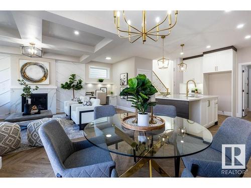 6632 Crawford Landing Landing, Edmonton, AB - Indoor Photo Showing Dining Room With Fireplace