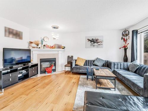 4123 22 Avenue, Edmonton, AB - Indoor Photo Showing Living Room With Fireplace