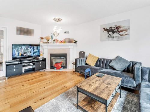 4123 22 Avenue, Edmonton, AB - Indoor Photo Showing Living Room With Fireplace