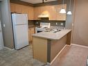 211 616 Mcallister Loop, Edmonton, AB  - Indoor Photo Showing Kitchen With Double Sink 