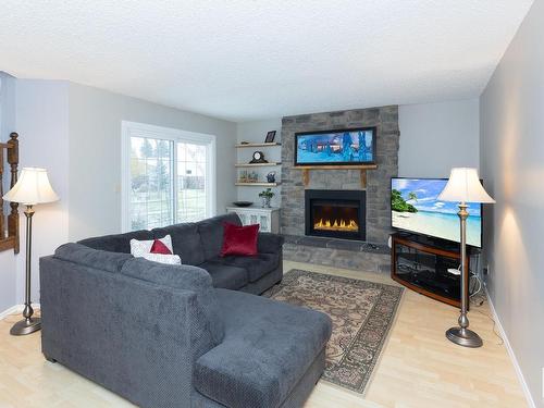 10627 108 Street, Westlock, AB - Indoor Photo Showing Living Room With Fireplace