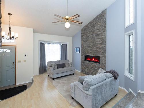 10627 108 Street, Westlock, AB - Indoor Photo Showing Living Room With Fireplace