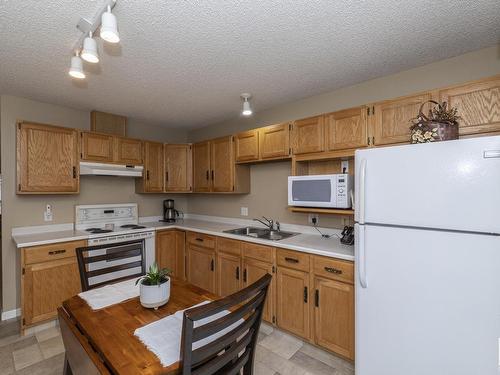 2 13217 155 Avenue, Edmonton, AB - Indoor Photo Showing Kitchen With Double Sink