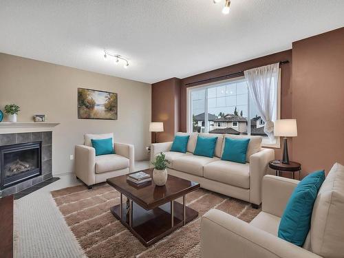 548 Leger Way, Edmonton, AB - Indoor Photo Showing Living Room With Fireplace