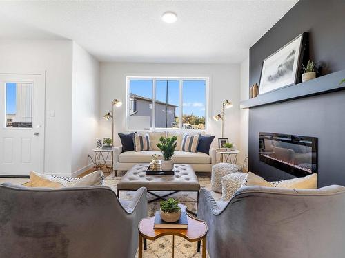 15 Kiwyck Link, Spruce Grove, AB - Indoor Photo Showing Living Room With Fireplace