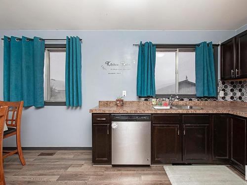 23 Bella Coola Drive, Leduc, AB - Indoor Photo Showing Kitchen With Double Sink