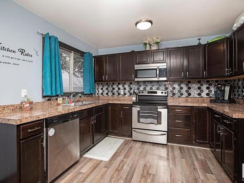 23 Bella Coola Drive, Leduc, AB - Indoor Photo Showing Kitchen With Double Sink