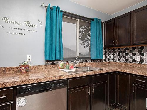 23 Bella Coola Drive, Leduc, AB - Indoor Photo Showing Kitchen With Double Sink