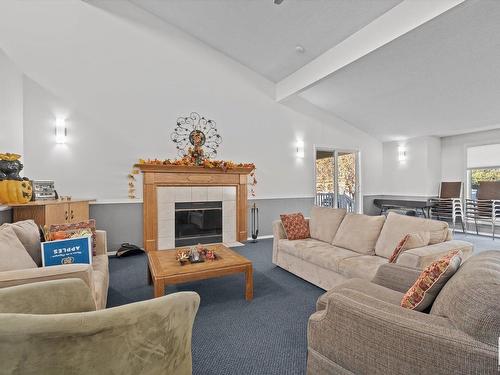 219 Knottwood Road Nw, Edmonton, AB - Indoor Photo Showing Living Room With Fireplace