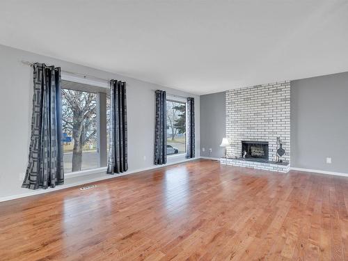 5714 52 St, Wetaskiwin, AB - Indoor Photo Showing Living Room With Fireplace