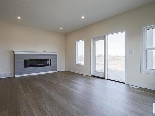 8 11 Dalton Link, Spruce Grove, AB - Indoor Photo Showing Living Room With Fireplace