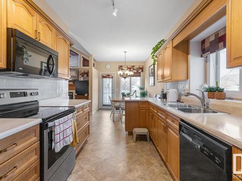 315 Ravine Villa(S), Leduc, AB - Indoor Photo Showing Kitchen With Double Sink