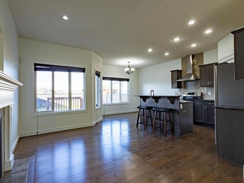 16808 40 Street, Edmonton, AB - Indoor Photo Showing Kitchen With Fireplace