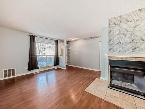 28 3111 142 Avenue, Edmonton, AB - Indoor Photo Showing Living Room With Fireplace