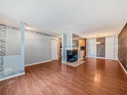 28 3111 142 Avenue, Edmonton, AB - Indoor Photo Showing Living Room With Fireplace